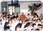  19 September 1976: His Holiness compassion was borderless. His Holiness was with deaf students to help raise funds for their schooling. His Holiness expressed himself with deaf students with the deaf sign language saying I love you at Sesatian School for the Deaf, Bangkok.